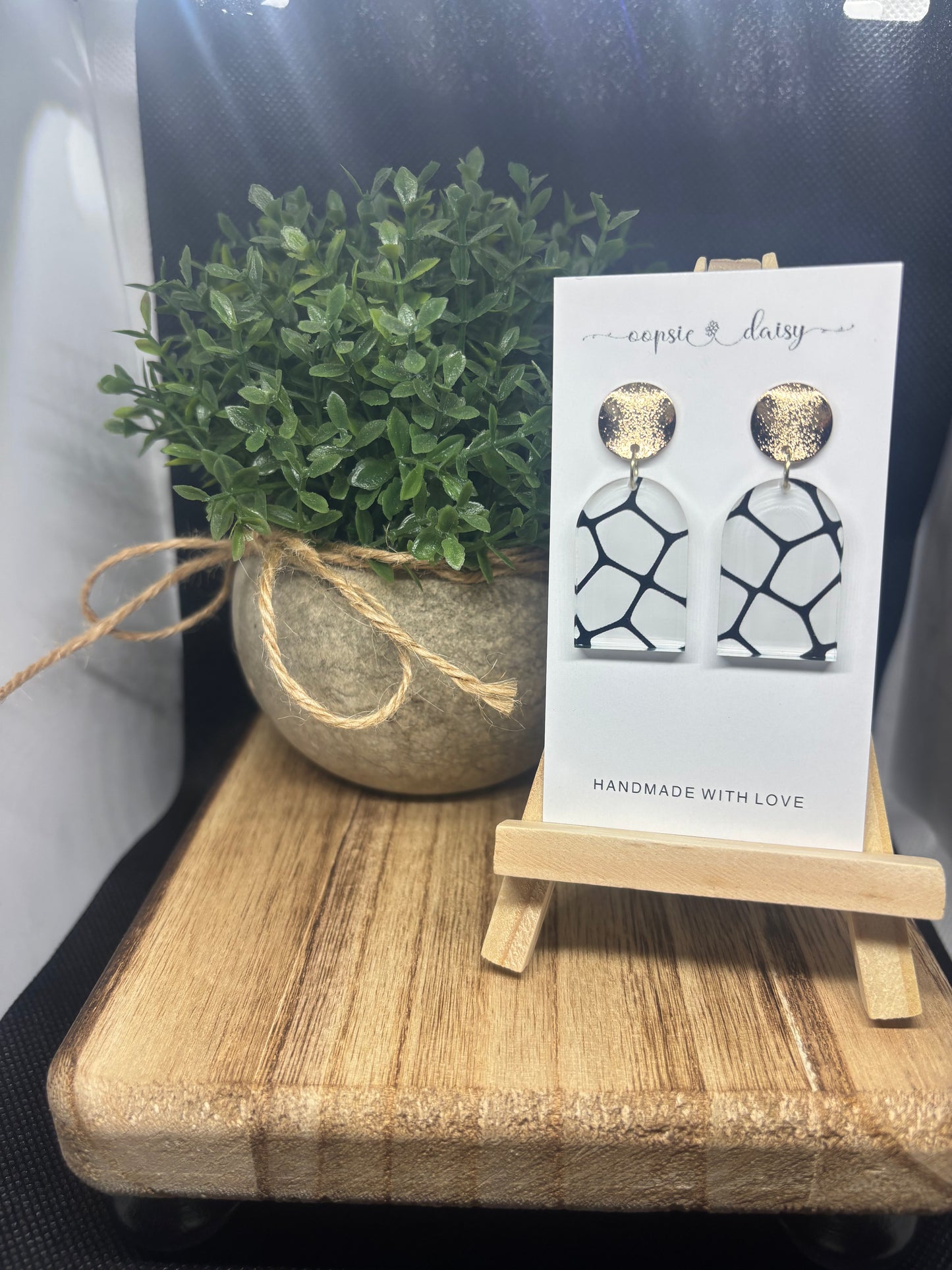 White and black with gold studs