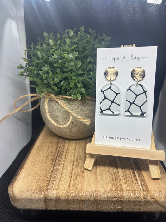 White and black with gold studs